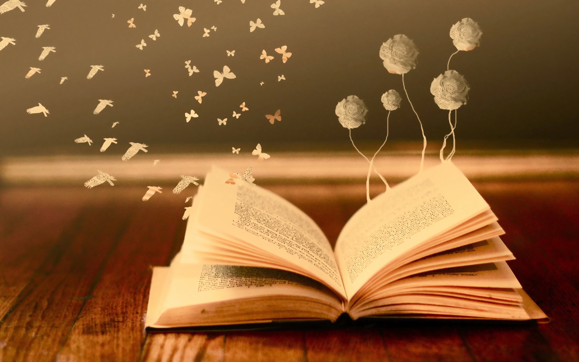 Livre ouvert avec des dessins d'oiseaux et de papillons